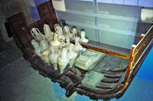 An exhibit in the Kyrenia museum, Cyprus, displaying a mock up of a portion of the Kyrenia hull with the cargo repositioned in one likely original location; © 1985 Susan W. Katzev.